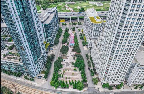 an aerial view of a city with tall buildings at Downtown Cozy 1BR Condo- Steps from Lake & King street in Toronto