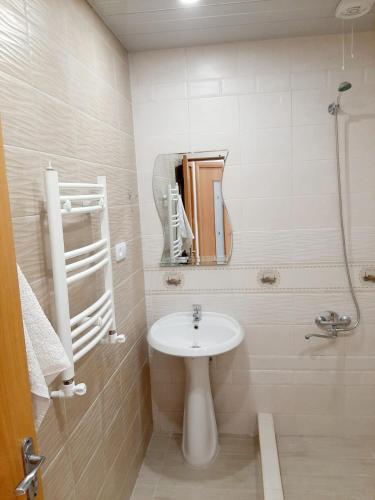 a bathroom with a sink and a mirror at holiday house in Yerevan