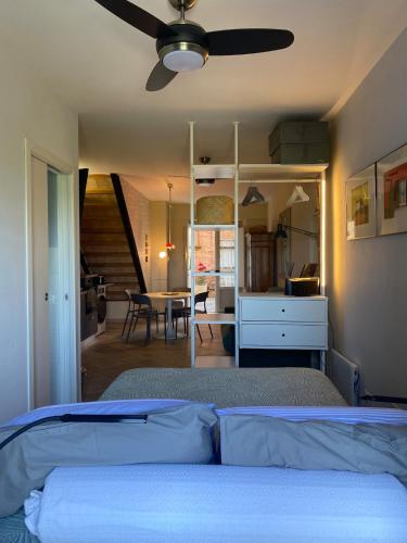 a bedroom with a bed with a ceiling fan at Casa Danesi in Monteleone dʼOrvieto