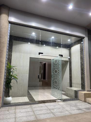 a glass door in the side of a building at أستديو كلاود السحاب in Al Baha