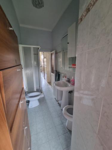 a bathroom with two toilets and a sink at La Casetta dei Monti Lepini in Segni