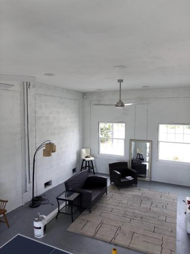 a living room with a couch and a table at Waterfront and Gulfview Retreat Hernando Beach in Hernando Beach