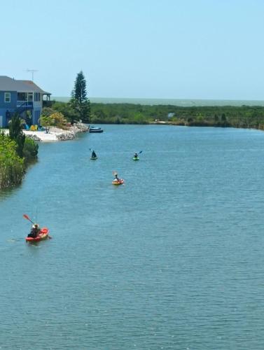 a group of people in kayaks on a river at Waterfront and Gulfview Retreat Hernando Beach in Hernando Beach