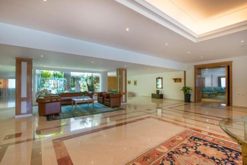 a large living room with couches and a table at Iberostar Waves Creta Panorama & Mare in Panormos Rethymno