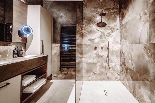 a bathroom with a shower and a sink at Dillhof Apartments in Eschau