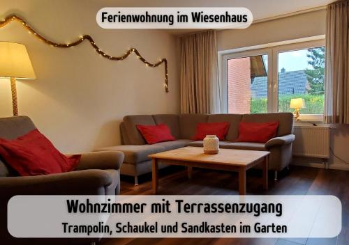 a living room with a couch and a coffee table at Bauernhof Wisch-Hof - 3 km zum Ostseestrand, 20 km nach Kiel - viele Ausflugsziele in der näheren Umgebung, ideal zum Fahrradfahren in Krokau