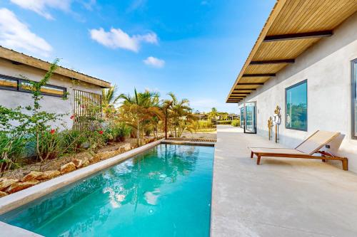 an image of a swimming pool in a house at Seabird - Villa 17 in Placencia Village