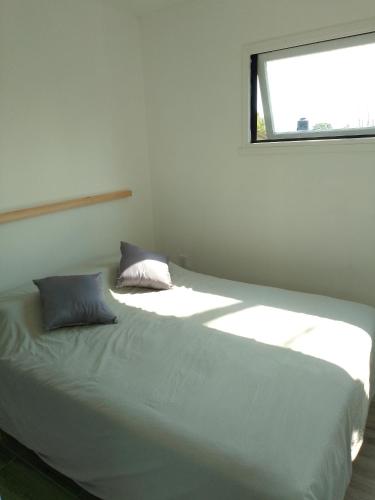 Ένα ή περισσότερα κρεβάτια σε δωμάτιο στο Tiny House Potrero Cba