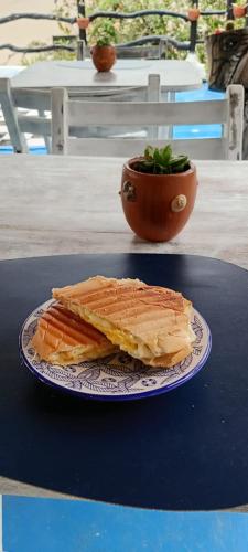 a sandwich sitting on a plate on a table at Pousada Cavallitos d'Amar in Ilha de Boipeba