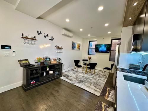 a kitchen with a counter and a dining room at BP STAYS - Hotel-Style, No Host, Professionally Managed ID286 in Jersey City