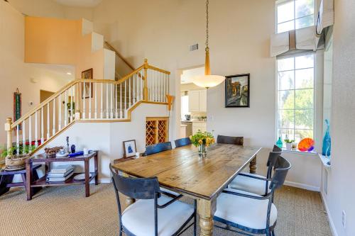 a dining room with a wooden table and chairs at 1 Block to Bay Pet-Friendly Retreat in Alameda! in Alameda