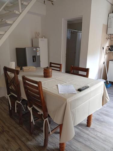 a table with a white table cloth on it at Apart Vital 3 in El Calafate