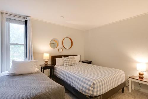 a bedroom with two beds and two mirrors on the wall at Close to Rocky Mtn Slopes! Cozy Silverthorne Condo in Sentinel Island