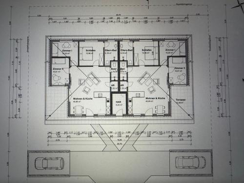 a drawing of a floor plan of a house at Ferienhäuser Wintermoor in Schneverdingen