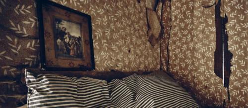 a bedroom with a bed with a picture on the wall at ponakary best stay in Jaffna