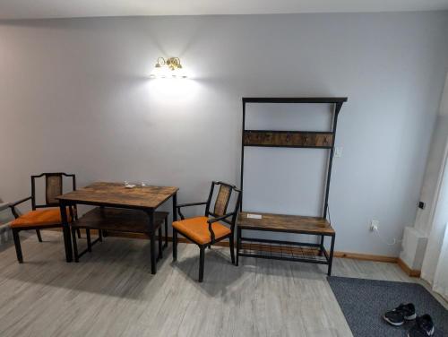 a room with chairs and a table and a light at Gordie's Inn & Suites in Alert Bay