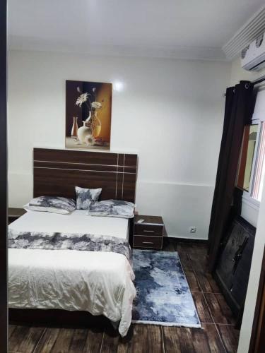 a bedroom with a bed and a fireplace at Grand Studio avec toutes les commodités in Dakar