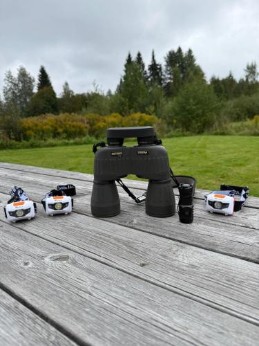 a video camera sitting on a wooden table at Stuga Fyra Säsonger - Fishing - Skiing - Hottub in Filipstad