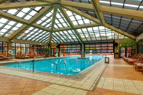 a large indoor swimming pool with a glass ceiling at Westgate Charm #4814B in Park City