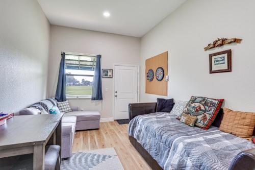 a living room with a couch and a table at Sebring Retreat with Direct Golf Course Access! in Sebring