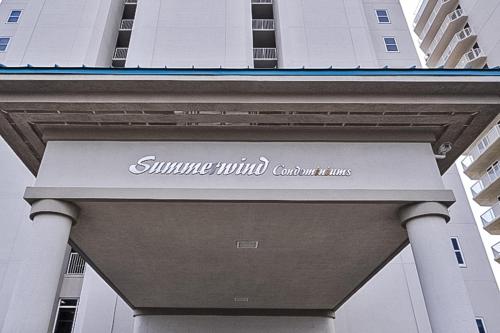 a sign for the sunshinewind courthouse on a building at Summerwind 0402 in Navarre