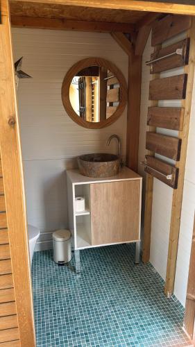 a bathroom with a sink and a mirror at Mirador de Pideago - Gratal y Nabiella in Bolea