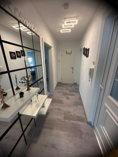 a hallway with two sinks and a mirror at Ferienwohnung Schwarzwälder Tulpe in Gernsbach