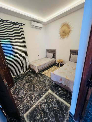 Katil atau katil-katil dalam bilik di Excellente Villa A Proximité De Marrakech