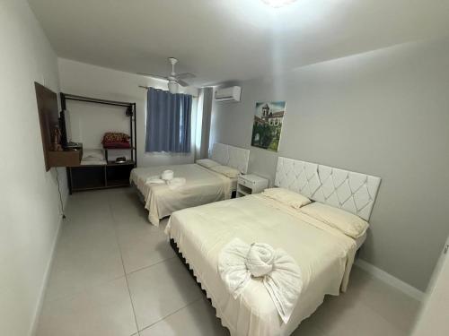 Katil atau katil-katil dalam bilik di Apart Residence Vista Lagoa Arraial do Cabo