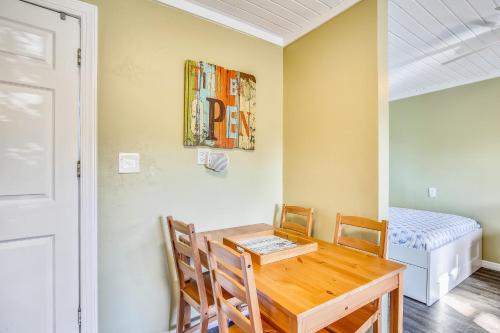 a dining room with a table and chairs and a bed at Fisherman's Hideaway in Conch Key