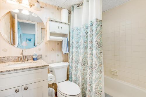a bathroom with a toilet and a sink and a shower at Sea Colony - 505 Chesapeake House Rd in Sea Colony