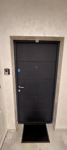 a large black garage door in a room at Apartman Nia in Priboj