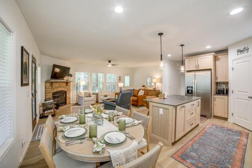 a kitchen and living room with a table and chairs at Lake Access, Pools and More Family Home in Stanwood in Canadian Lakes