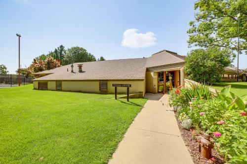 a building with a green lawn in front of it at Lake Access, Pools and More Family Home in Stanwood in Canadian Lakes