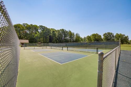a tennis court with four tennis nets on it at Lake Access, Pools and More Family Home in Stanwood in Canadian Lakes