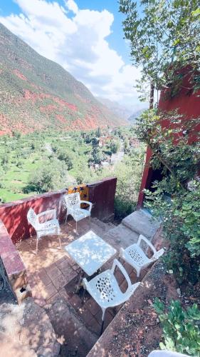 a group of chairs and a table on a patio at Chez Mazgiti in Ourika