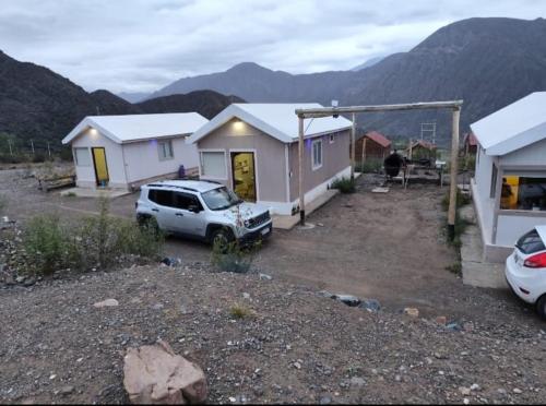 a car parked in front of a house at Alta Montaña in Potrerillos
