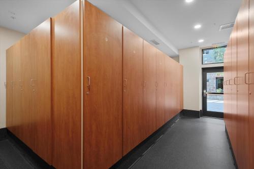 a row of wooden lockers in a locker room at The Powder Post Capitol Peak Lodge #3225 in Snowmass Village