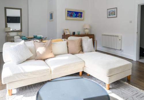 a living room with a white couch and a table at Cathedral view in Lichfield