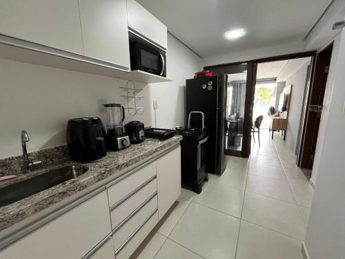 Kuchyň nebo kuchyňský kout v ubytování Conforto beira mar Flamboyant