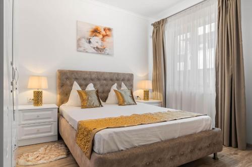 a bedroom with a large bed and a window at Moonlight Flower in Mamaia