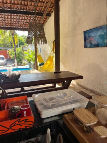 a kitchen counter with a table with a net at CASA DA PIPA in Pipa