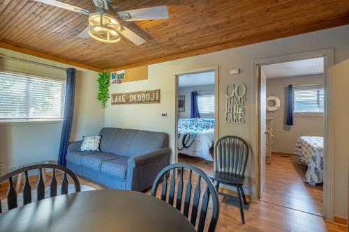 a living room with a couch and a table and chairs at Blue Water Bungalows in Milford