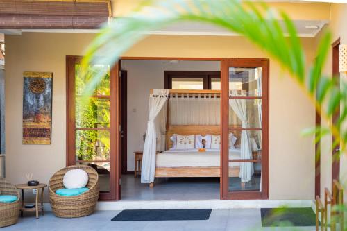 Ένα ή περισσότερα κρεβάτια σε δωμάτιο στο Island Getaway Villa