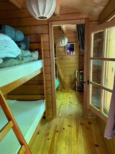 Una cama o camas en una habitación de Refuge Nature - Chalet avec Terrasse vue forêt
