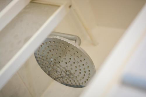 a close up of a shower head in a bathroom at Hotel della Vittoria in Ancona