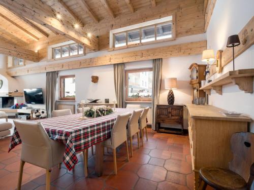 a kitchen and dining room with a table and chairs at Luxury Central Kirchberg in Kirchberg in Tirol