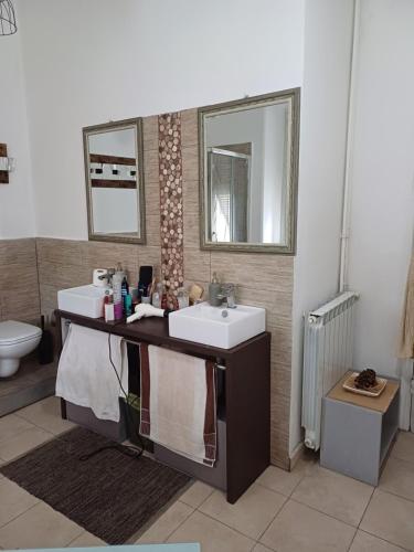 a bathroom with a sink and a mirror at Marina's House in La Spezia