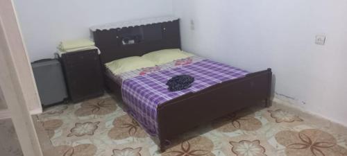 Postel nebo postele na pokoji v ubytování Ashila hawmat ginawa