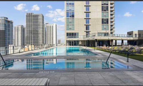 a large swimming pool on the roof of a building at Downtown Miami Luxury Condo apartment in Miami